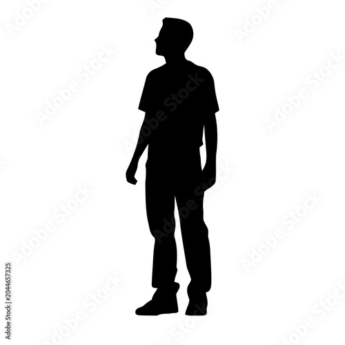 Silhouette of a standing young man looking up, isolated on white
