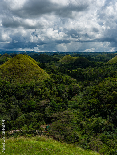 Chocolate Hills of Bohol with a small hut in the valley