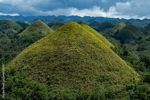 Symmetrical green Chocolate Hill against a moody sky, Bohol