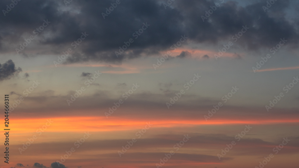 Fototapeta premium Sunset Sky with Orange and Dark Clouds