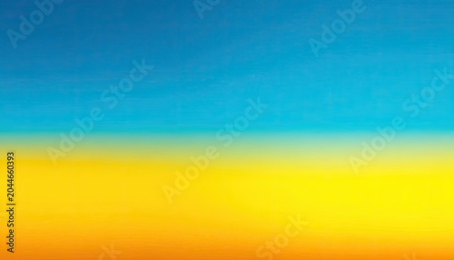 Blended blue sky above vibrant yellow and orange ground