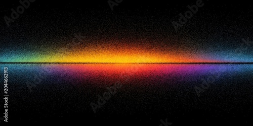A horizontal spectrum of color reflected on a dark surface