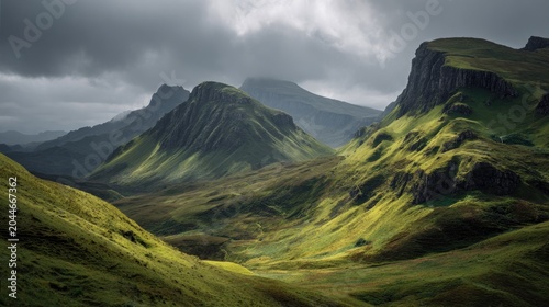 Dramatic green hills and mountains under stormy, cloudy sky