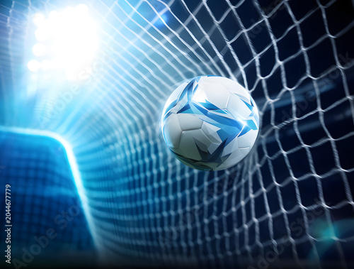 Soccer ball hitting the goal net during a night game, celebrating a score under bright stadium lights, symbolizing victory, success, and achievement in international sport