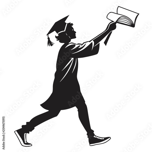 Fotografie Graduate in a cap and gown holds a book aloft to celebrate academic achievement and future success