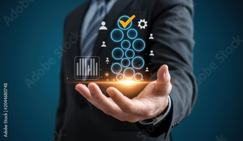 Businessman holding hologram of business icons data management and quality control concept.