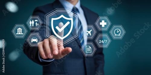 Executive hand selecting digital shield icon for insurance protection services surrounded by icons for home car health and travel coverage.