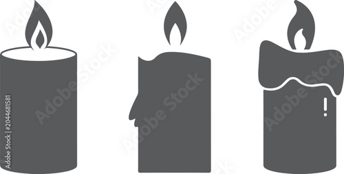 Bild auf Leinwand Three distinct gray candle featuring different shapes and burning flames isolate