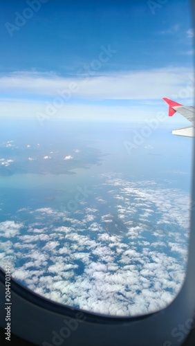 Fotografía View from Airplane Window Above the Clouds