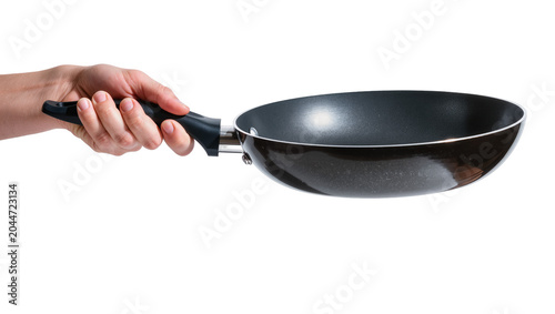 Quadro su tela Hand holding black frying pan with metal rim