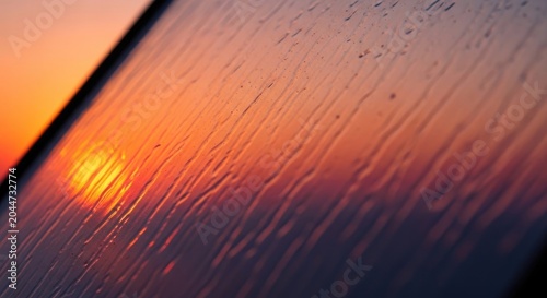 Sunset Through a Window with Raindrops - A Beautiful Orange Sky.