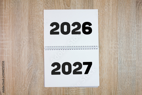 2026-2027 numbers on a notebook, business concept. The arrival of 2027, abstract wallpaper. Notebook with the numbers of 2027.