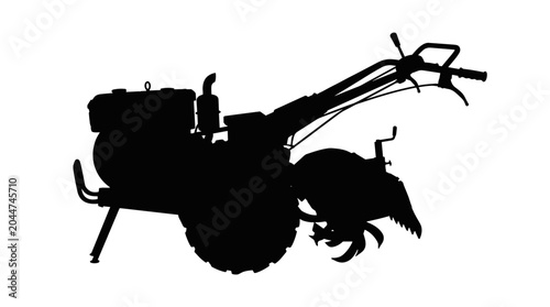 Silhouette of a walking tractor with tilling blades.