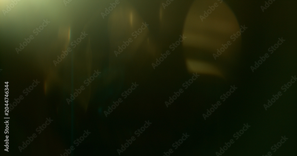 Naklejka premium Abstract cinematic lens flare with soft bokeh circles and subtle light reflections. Atmospheric optical effect background ideal for overlays, visual effects, film production and creative design.