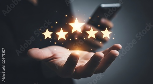Glowing Five Star Rating on Open Hand with Smartphone