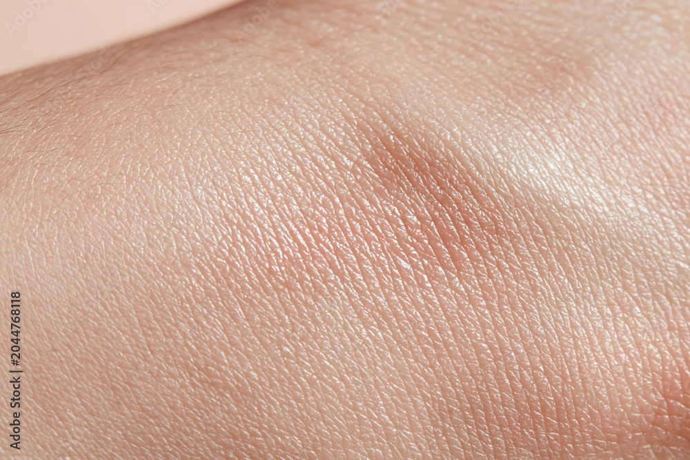 Fototapeta premium Hydrated skin closeup, smooth glowing surface, natural texture and fine lines visible, soft neutral tone and healthy sheen conveying gentle care and skin wellness