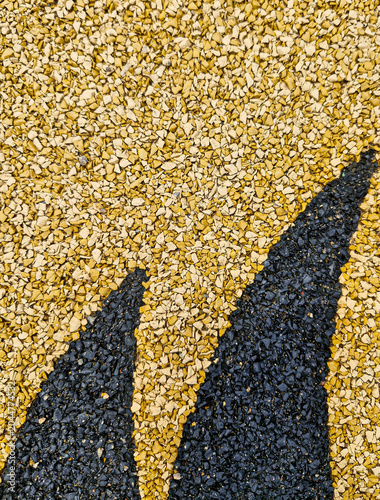Bild auf Leinwand Yellow and black rubber safety surfacing with abstract pattern, playground granu