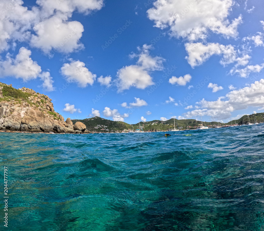 Obraz premium A view of Gustavia, St. Barts harbor from the water.