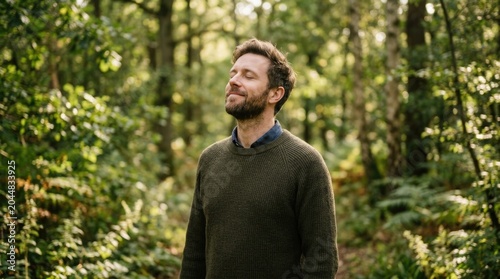 Relaxed Man Practicing Mindfulness Outdoors with Eyes Closed in Peaceful Forest Setting