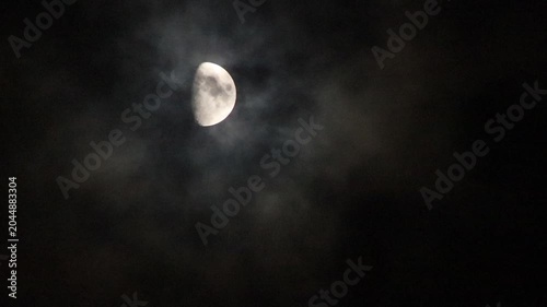 half moon and clouds at night