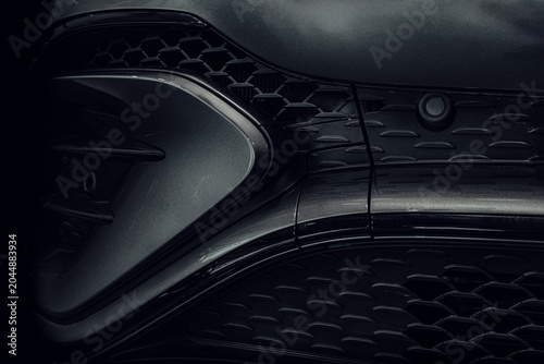 Foto Sleek design of a premium Mercedes-Benz GLE luxury SUV car shot in a dark studio showcase with dramatic low-key lighting