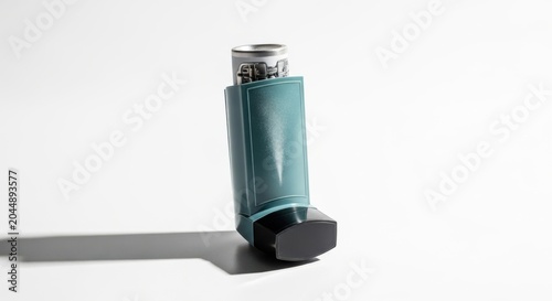 Teal inhaler on white background asthma medication