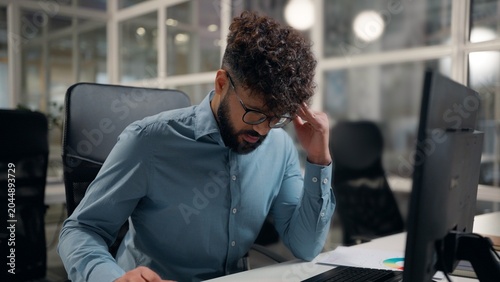 Slika na platnu Stressed suffering Arabian business man holding head suffer thinking headache pr