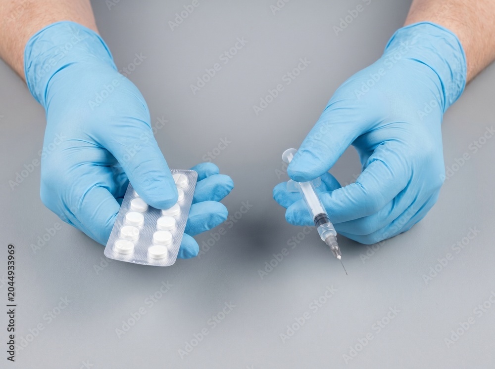 Obraz premium Hands offering a needle or pills