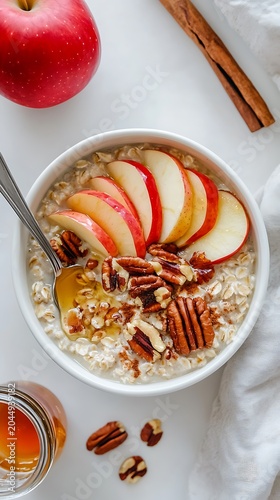 Sweetened apple pecan oatmeal with honey drizzle for healthy breakfast