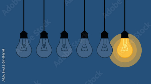 Valokuva Single lit light bulb among unlit ones, representing an idea or innovation