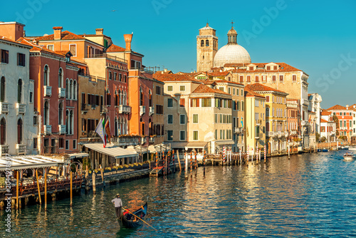Classic view of the Grand Canal with a gondola and San Geremia church in Venice, Italy