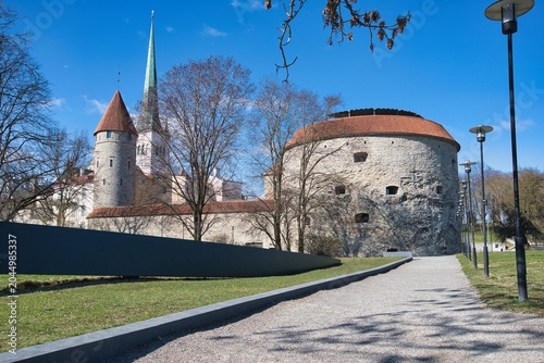 Fotografie Historic Fat Margaret Tower and St Olaf Church in Tallinn Old Town