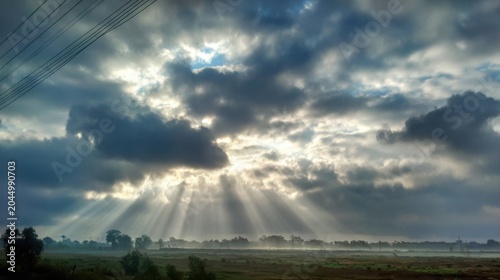 The sunlight shines through the clouds, it's so beautiful. in the morning
