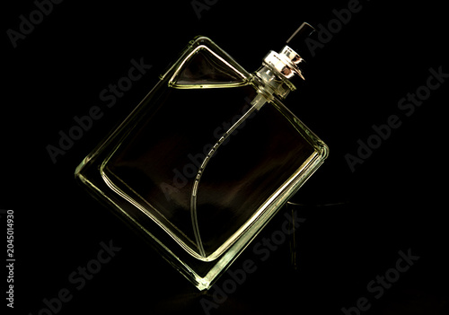 Classic men's cologne on black paper background.