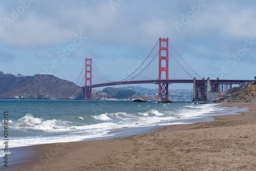 Golden Gate Bridge view from the sandy shore of Baker Beach in San Francisco, California, USA