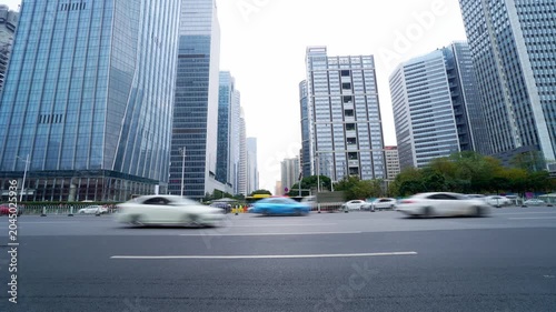 Urban Traffic in Modern Business District with Glass Skyscrapers