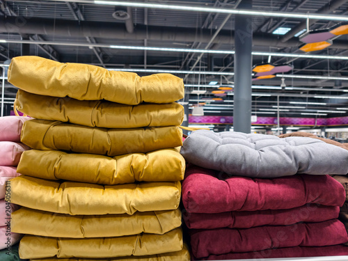 Photos Seat cushions with textile covers presented on supermarket racks with padded cha