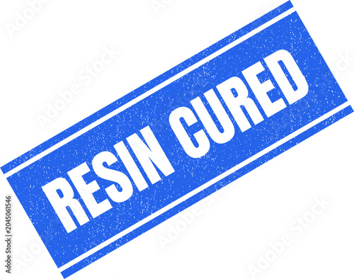 Schilderij op canvas A blue rectangular rubber stamp with the text resin cured displayed in white bol