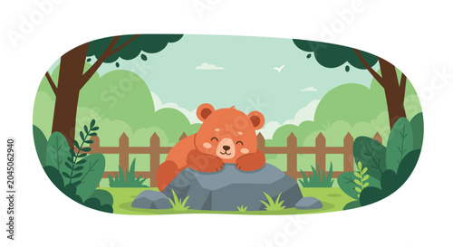 Adorable brown bear cub sleeping peacefully on a grey rock in a lush green forest clearing surrounded by trees and a wooden fence.