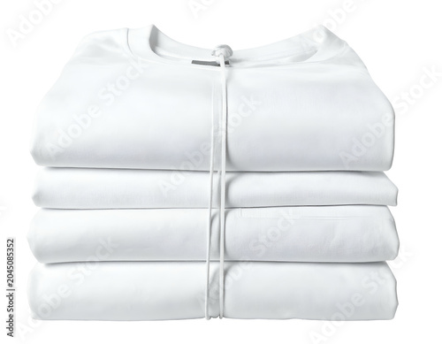Stacked white garments, neatly folded and secured with a cord
