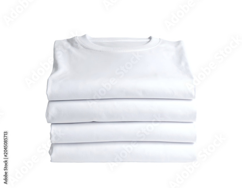 Stack of neatly folded, crisp white t-shirts