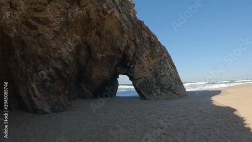 POV Walk Towards Iconic Sea Arch at Praia da Adraga on the Atlantic Coast, Sintra, Portugal