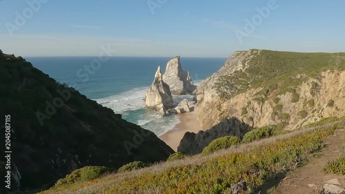 Static Shot of Dramatic Sea Stacks and Limestone Cliffs at Praia da Ursa, Sintra, Portugal
