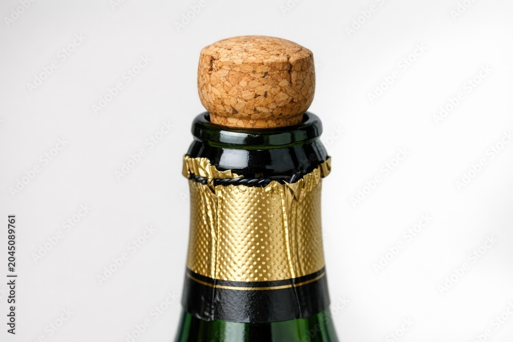 Fototapeta premium Close-up shot of a bottle of wine with its cork removed, ready to be poured