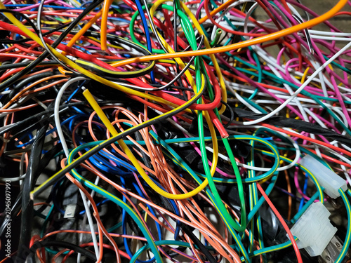 A pile of colorful, tangled, thin electrical wires