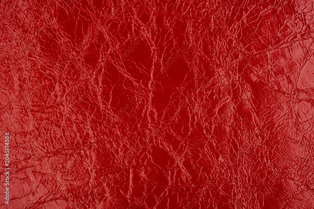 Fototapeta premium Macro shot of red cracked leather texture
