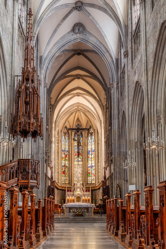 Gothic church nave altar and stained glass windows