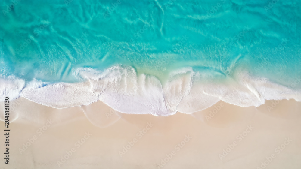 Fototapeta premium Aerial View of Turquoise Waves at Sandy Beach