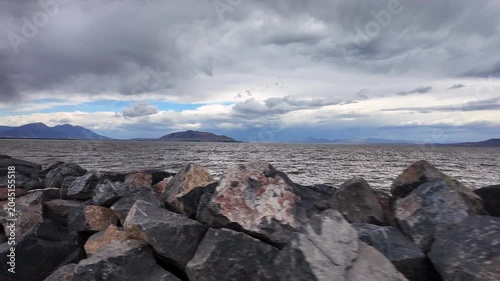 Driving along the rocks on the Utah Lake shoreline looking towards West Mountain.