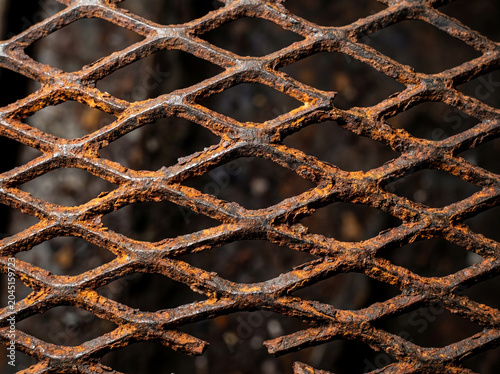 Rusted Expanded Metal Mesh Industrial Texture — Orange Rust Grunge Pattern
